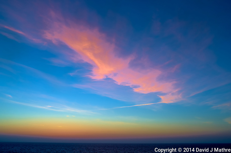 Pink clouds at dawn over the Atlantic Ocean from the deck of the MV Explorer. Image taken with a Leica X2 camera.